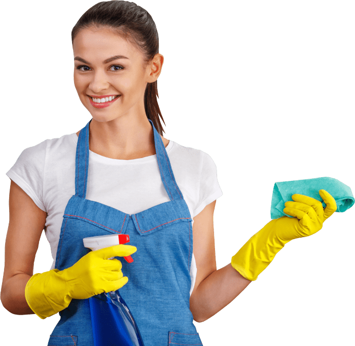A smiling cleaning professional holds up a spray bottle and a cleaning cloth.